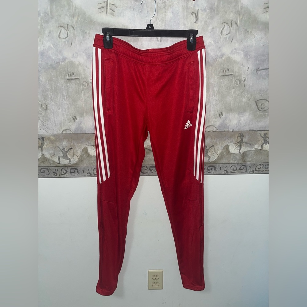 Women’s Adidas track pants with side zippers. Climacool effect
